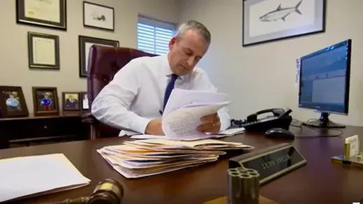attorney jeff paulk at his desk with files
